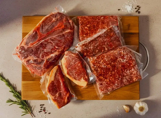Diamond D Ranch best beef cuts: NY strip, roast, and ground beef, vacuum-sealed on board with garlic, salt, and herbs