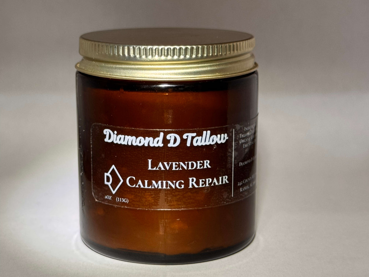A brown glass jar with a gold lid labeled "Diamond D Tallow." It contains "Lavender Calming Repair." The tone is soothing and natural.